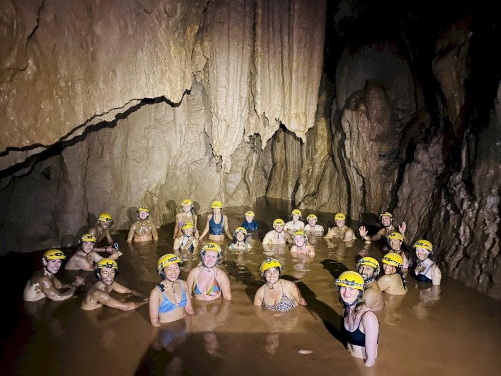 Conclude the adventure by immersing in the cave's natural mud baths, providing relaxation after the exploration (Source: Phong Nha Discovery)